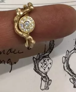 ring med roset og gren med knupper